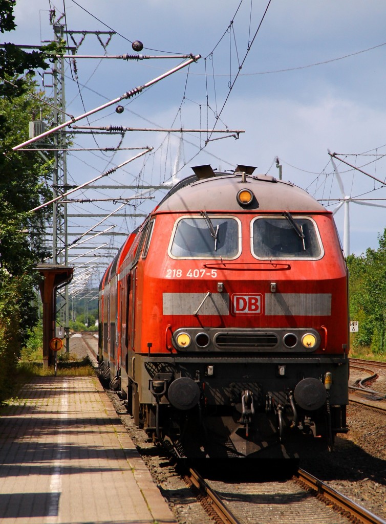 DB Regio Kiel 218 407-5 mit der RB nach Kiel bei der Einfahrt in Jübek. Jübek 21.06.2014