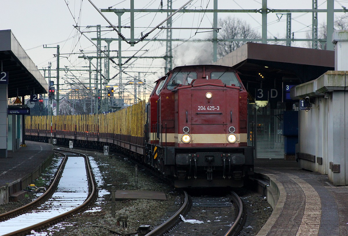 MTEG 1203 220 und 3202 347 dieseln hier mit lautem Pfiff durch Neumünster Richtung Jübek. 20.01.2016