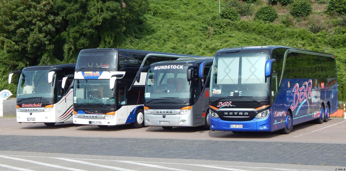 Setra 415 HD von Krautscheid und Setra 431 DT von Stewa und Setra 411 HD von Mundstock und Setra 516 HDH von Berr aus Deutschland im Stadthafen Sassnitz.