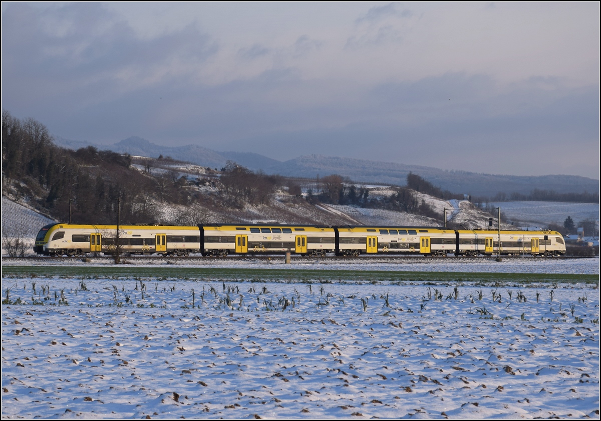 Zwischen Belchensystem und Blauendreieck. 

Ein Desiro HC von bwegt Richtung Basel bei Buggingen. Februar 2021.