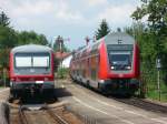 628/928 342 begegnet am 29.07.2011 in Nonnenhorn einem durchfahrenden IRE nach Lindau.