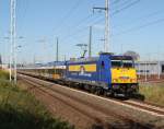 146 520-2 mit X 68904 von Warnemnde nach Leipzig Hbf kurz nach der Ausfahrt im Rostocker Hbf.30.09.2011