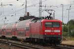  112 115-1 schob am 20.07.2012 RE 4361 von Rostock Hbf nach Berlin Sdkreuz aus dem Rostocker Hbf.