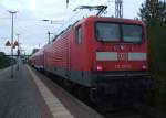 112 107-8 mit S1 von Warnemnde Richtung Rostock Hbf kurz nach der Ankunft im Bahnhof Rostock-Bramow.(12.10.10)