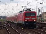 114 006-0 mit RE 38306 von Jterbog Richtung Stralsund bei der Einfahrt um 08.51 Uhr im Bahnhof Stralsund.(28.08.10)