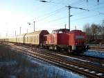 298 318 unterwegs am 27.Januar 2011 mit mehren Hbbills-Wagen in Bergen/Rgen.