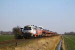 218 497 + 218 421 vor Autozug auf der Rückfahrt nach Westerland, aufgenommen mit Vorsignal am Bü Südergotteskoog 20.03.2022 