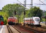 DB 218 329-1 mit der RB nach Kiel hat Einfahrt in Schleswig, der ICE 386 nach Aarhus verlässt Schleswig...22.06.2014