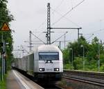 NRS Lübeck 223 143 dieselt hier mit einem Holz-Leer-Zug auf dem Weg nach Padborg durch Schleswig.