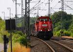 Mal von der anderen Seite gezeigt...DB 261 055-8 rangiert hier mit leeren Holzwagen vom Typ Snps in die Ladestrasse im/am Bhf Jübek.