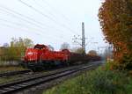 261 030-1 dieselt hier mit einem Holzzug aus Jübek durch Schleswig.