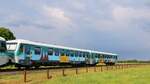 DB 628 201 mit der  bunten Seite  festgehalten am Bü Jyderupweg in Jübek.