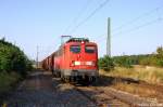 140 172-8 mit dem Kalizug in Demker auf dem Weg zu den Kaliwerke in Zielitz.