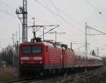 114 040-9+143 210-3 mit IRE18539 von Rostock Hbf nach  Berlin Hbf(tief)  bei der Ausfahrt im Rostocker Hbf.28.02.2014 