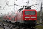 Bei norddeutschen Schmuddelwetter hatte Die Cottbuser 112 105-2 mit RE 4352 von Halle(Saale)Hbf nach Rostock Hbf ihr Ziel fast erreicht Ankunft war pnktlich um 09:23 Uhr Aufgenommen am 25.10.2014