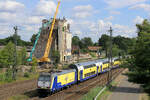 146 -04 verl�sst den Bahnhof Tostedt. Im Hintergrund: die Abrissarbeiten der alten Siloanlagen, die alten Lagerhallen links und rechts vom Silo sind schon  platt ! Datum: 06.08.2026