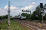 186 148-3 Captrain mit Getreidezug in Dieskau Richtung Leipzig unterwegs.