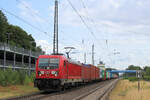 187 154 mit Containerzug am 30.06.2023 in Tostedt.