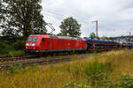 Die 185 058-5 (91 80 6185 058-5 D-DB) der DB Cargo AG fährt am 11 Juli 2024 mit einem langen beladen Autotransportzug (Wagen der Gattung Laaeks 553 der DB Cargo Logistics GmbH, ex ATG), durch