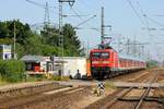 DB 112 179 rauscht hier mit SH-Express/RE 7 aus Hamburg kommen durch Jübek.