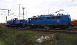 PRESS  140 038-0  140 851-7 bringt hier die Metrans/HHLA 2915 092-1 zum Hafen.