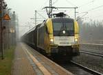 Aus dem Archiv: Da fuhr er noch für BoxXpress der  gelbe Stier ....182 515-6 hier bei der regnerischen Durchfahrt mit einem H-Zug Richtung Padborg in Schleswig.