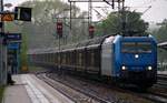 AngelTrains/CFL Cargo 185 519-6 durchfährt mit dem DGS 49703 während eines leichten Schauers Schleswig.