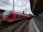 Treffen im Stralsunder Hbf.links RE9 von Stralsund Richtung Ostseebad Binz in der Mitte steht 120 125-0 mit IC1805/1815 von Ostseebad Binz/Seebad Heringsdorf nach Kln Hbf.rechts steht 218