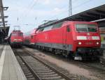 Treffen im Rostocker Hbf link´s steht 115 509-2+IC1861 von   Hamburg-Altona Richtung Seebad Heringsdorf und recht´s steht   120 201-9+RE 33012(Rostock-Hamburg).Aufgenommen am 06.08.10