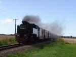 99 2323-6 mit MBB14625 von Ostseebad Khlungsborn West Richtung   Bad Doberan kurz vor dem Haltepunkt Steilkste/Wittenbeck.(05.09.10)