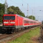 112 115-1 mit Sonderzug 2670 von Warnemnde nach Berlin Gesundbrunnen bei der Durchfahrt im Bahnhof Rostock-Bramow.17.06.2012