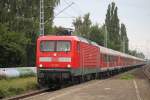 112 107-8 mit dem Pommes Rot-Wei Express 13290 von Warnemnde nach Berlin-Ostbahnhof bei der Durchfahrt am 12.08.2015 im Haltepunkt Rostock-Holbeinplatz