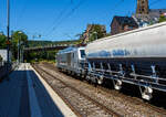 Die 248 059 alias DM4003 (90 80 2248 059-8 D-RHC), eine SIEMENS Vectron Dual Mode, der RheinCargo f�hrt am 28 Juli 2026 mit einem Kalkzug durch den Bahnhof Kirchen (Sieg) in Richtung K�ln. Der Zug bestand aus vierachsigen Trichtermittenentladewagen mit Schwenkdach der Gattung Tadns.

Die SIEMENS Vectron DM wurde 2023 von der Siemens Mobility GmbH in M�nchen-Allach unter der Fabriknummer 23811 gebaut und im Oktober 2023 an die RheinCargo GmbH & Co. KG (Neuss) geliefert. Die Lok hat die Zulassung, f�r 160 km/h, nur f�r Deutschland.

Die RheinCargo GmbH & Co. KG ist ein Gemeinschaftsunternehmen der H�fen und G�terverkehr K�ln AG (HGK) und der Neuss-D�sseldorfer H�fen GmbH & Co. KG (NDH), die zu jeweils 50 % Eigent�mer sind. Die Gesellschaft wurde 2012 gegr�ndet.  