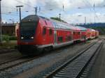 Mit Dostos vom HanseExpress und geschoben von 112 118 fuhr,am 05.Juli 2011,RE 13006 von Sassnitz nach Rostock,in den Bahnhof Bergen/Rgen.