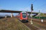 112 121 verlsst gerade mir ihrer Dostos Garnitur den Bahnhof Wustermark und nchster Halt ist dann Buschow.