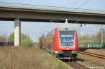 In Wustermark verlsst die 112 189 mit ihrer nicht blichen 3 Dostos Garnitur den Bahnhof Wustermark.