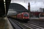 BB-Taurus 1116 144-5 mit einem Autotransportzug durch fhrt den Bremer Hbf. 06.12.2011