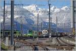 Ein Tele-Blick ins TPC D�p�t in Aigle, welcher neben den frisch verschneiten Bergen im Hintergrund, besonders den neuen TPC/ASD ABe 4/8 471 (Baujahr 2023) neben dem ASD BCFe 4/4 N� 1  TransOrmonan 